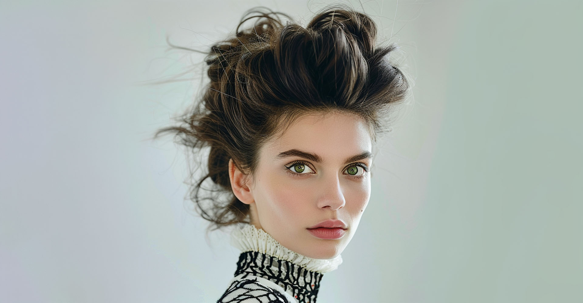 Sculpted blonde hair styled in a voluminous updo